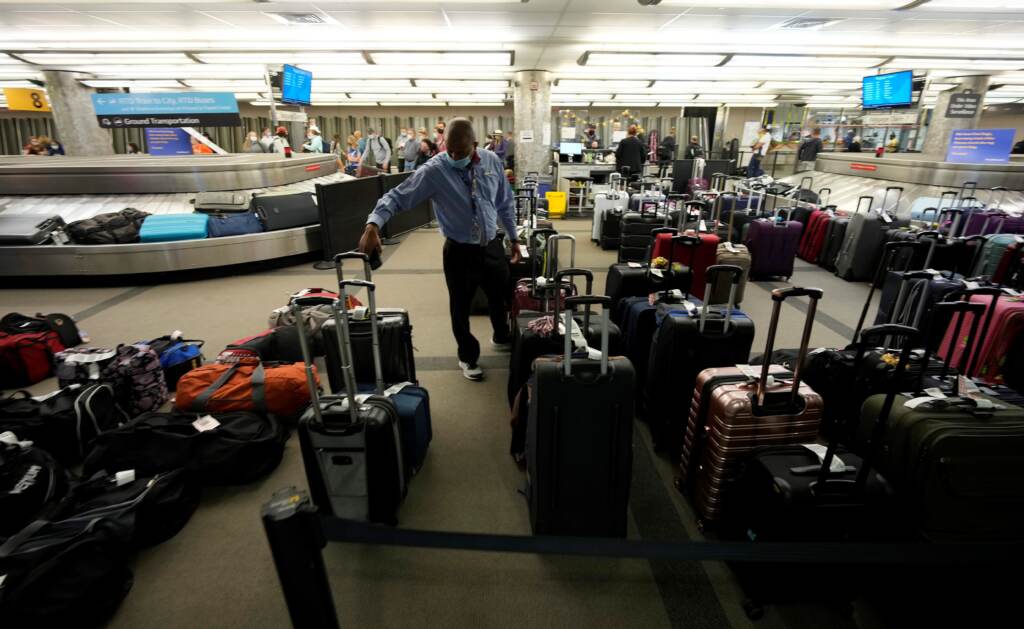 Unclaimed baggage wells up between carousels for passengers arriving on Southwest Airlines flights at Denver International Airport late Sunday, Oct. 10, in Denver. Unclaimed baggages wells up between carousels for passengers arriving on Southwest Airlines flights at Denver International Airport late Sunday, Oct. 10, 2021, in Denver. Southwest Airlines canceled hundreds of flights over the weekend, blaming the woes on air traffic control issues and weather. (AP Photo/David Zalubowski)