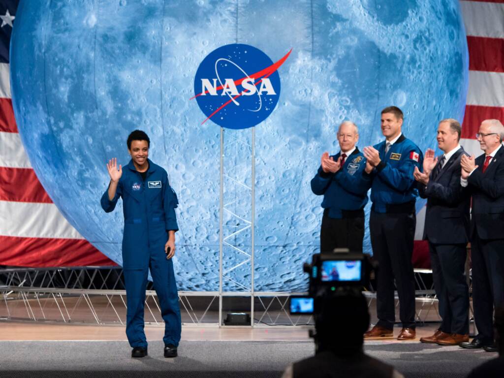 NASA astronaut Jessica Watkins (L) waves at the audience during during the astronaut graduation ceremony at Johnson Space Center in Houston Texas, on January 10, 2020. - The 13 astronauts, 11 from NASA and 2 from CSA, are the first candidates to graduate under the Artemis program and will become eligible for spaceflight, including assignments to the International Space Station, Artemis missions to the Moon, and ultimately, missions to Mars, according to NASA. (Photo by Mark Felix / AFP) (Photo by MARK FELIX/AFP via Getty Images)