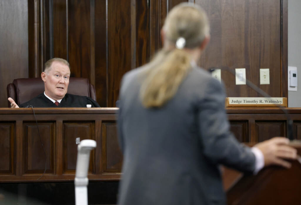 Judge Timothy Walmsley speaks to defense attorney Franklin Hogue during the jury selection process in the trial of the men charged with killing Ahmaud Arbery, at the Glynn County Superior Court in Brunswick, Ga., on Oct. 27. Judge Timothy Walmsley speaks to defense attorney Franklin Hogue during the jury selection process in the trial of the men charged with killing Ahmaud Arbery at the Glynn County Superior Court, on October 27, 2021 in Brunswick, Georgia. Greg and Travis McMichael and their neighbor, William