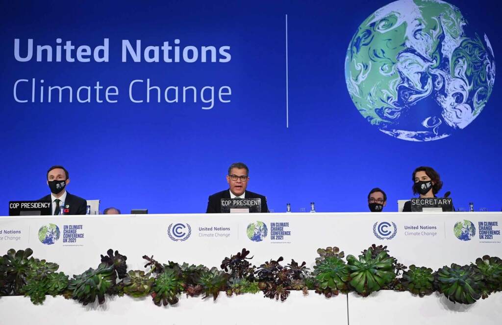 Last minute resistance at the COP26 summit over efforts to phase out coal left many countries disappointed, but the agreement still marked new progress. President Alok Sharma (C) speaks at a table at a UN conference