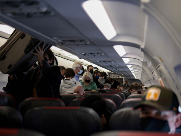 Passengers deplane from an airplane after landing at the Albuquerque International Sunport on November 24, 2021 in Albuquerque, New Mexico. FAA expects the number of travelers for Thanksgiving to reach pre-pandemic levels, with more than 53 million people traveling in total in the days leading up to the holiday. (Photo by Anna Moneymaker/Getty Images)