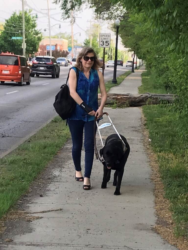 Heather Leiterman walks with her guide dog