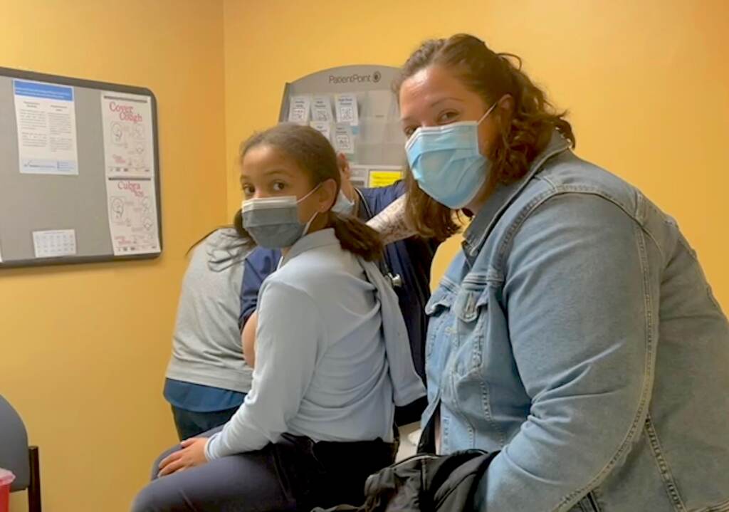 Olivia Jolley, 8, with her mother Jimena after getting the vaccine at Westside Family Healthcare in Wilmington. (Courtesy of Westside)
