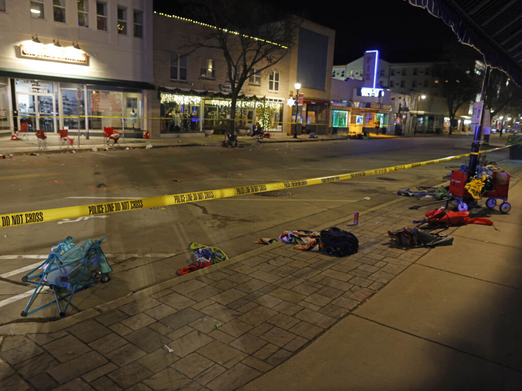 APTOPIX Christmas Parade SUV Police tape cordons off a street