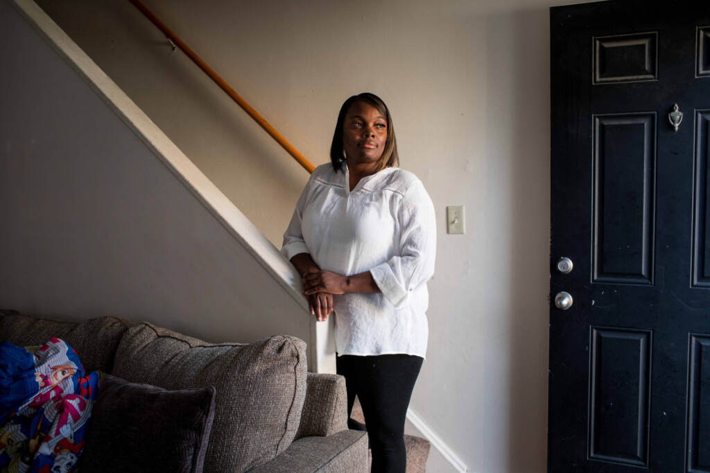 Maryanne Lundy, a single mother of three, had to quit her job at a hospital when the pandemic started Maryanne Lundy poses for a portrait at her home on Friday, Nov. 19, 2021 in Indianapolis. Kaiti Sullivan/NPR