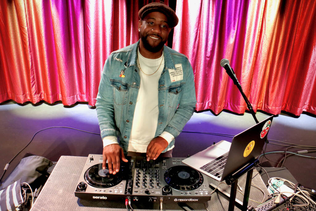 2021 12 02-e lee-clint coley-brooklyn bowl philly fishtown-world series of spades watch party dj 1 A person DJs at a launch party