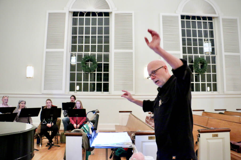 2021 12 08-e lee-donald nally-philadelphia chestnut hill presbyterian church-the crossing choral ensemble carols after a plague windows Conductor Donald Nally leads The Crossing choral ensemble during a rehearsal at the Presbyterian Church of Chestnut Hill. (EmmaLee/WHYY)