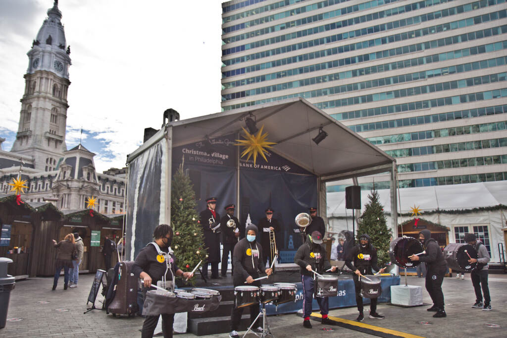 2021 12 3 k paynter salvation army red kettle month The Mad Beatz Philly drumline and the Salvation Army Brass Quartet kicked off Salvation Army Red Kettle Month at the LOVE Park Christmas Village on December 3, 2021. (Kimberly Paynter/WHYY)