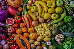 Purple, red, orange, yellow, and green fruits and vegetables grouped by color