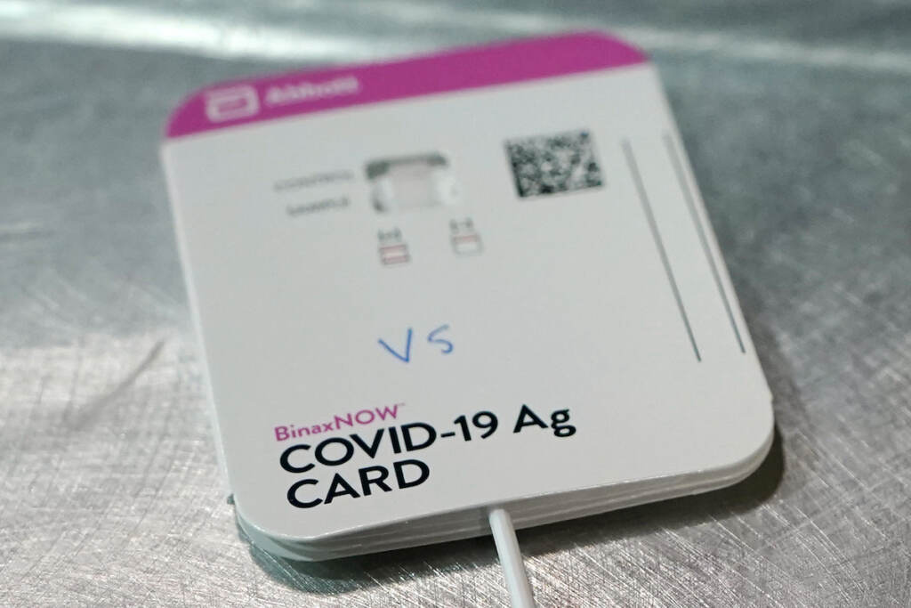 Virus Outbreak Home Tests A BinaxNOW rapid COVID-19 test made by Abbott Laboratories rests on a table in the room where student-athletes at Pacific Lutheran are tested three times a week, Wednesday, Feb. 3, 2021, in Tacoma, Wash.