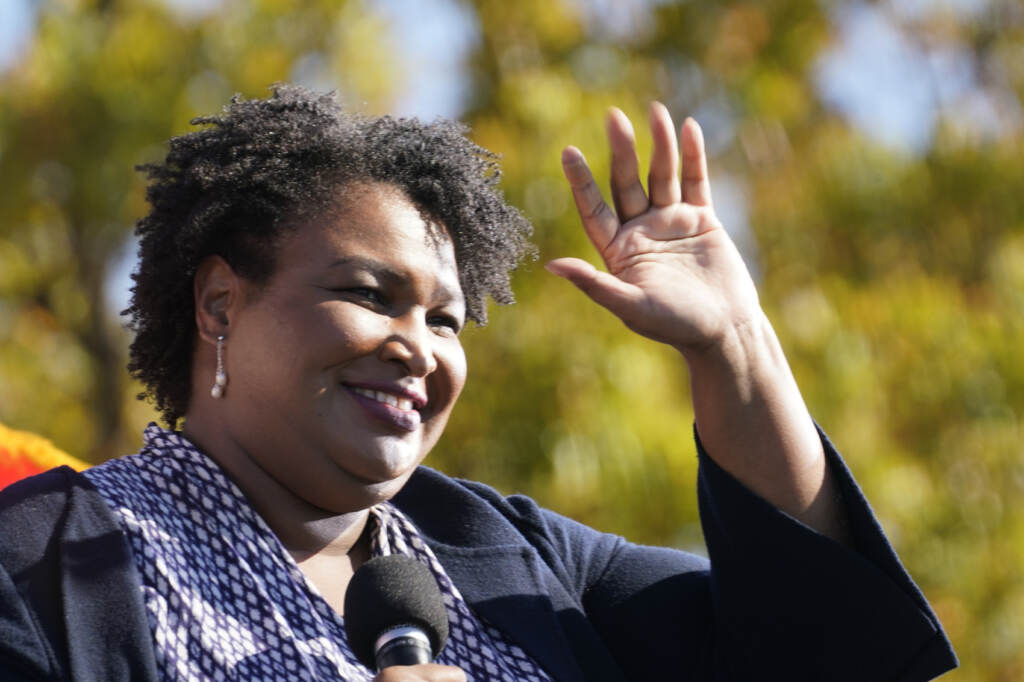 Stacey Abrams FILE - In this Monday, Nov. 2, 2020, file photo, Stacey Abrams speaks to Biden supporters as they wait for former President Barack Obama to arrive and speak at a campaign rally for Biden at Turner Field in Atlanta. (AP Photo/Brynn Anderson, File)