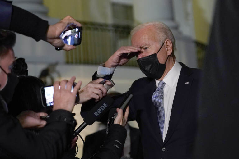 President Joe Biden talks with reporters at the White House in Washington, Friday, Dec. 3, 2021, as he prepares to leave for Camp David