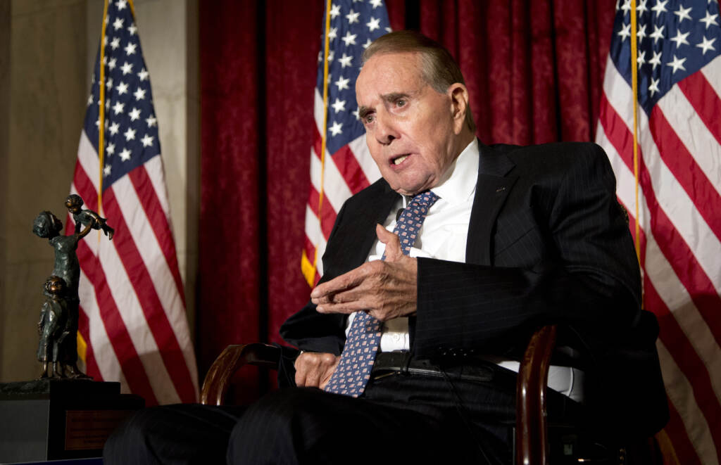 Obit Bob Dole FILE - Former Senate Majority Leader Bob Dole, right, speaks after being presented with the McGovern-Dole Leadership Award by Vice President Joe Biden, to honor his leadership in the fight against hunger, during the 12th Annual George McGovern Leadership Award Ceremony hosted by World Food Program USA, on Capitol Hill in Washington, Wednesday, Dec. 11, 2013. Bob Dole, who overcame disabling war wounds to become a sharp-tongued Senate leader from Kansas, a Republican presidential candidate and then a symbol and celebrant of his dwindling generation of World War II veterans, has died. He was 98. His wife, Elizabeth Dole, posted the announcement Sunday, Dec. 5, 2021, on Twitter. (AP Photo/Manuel Balce Ceneta, File)