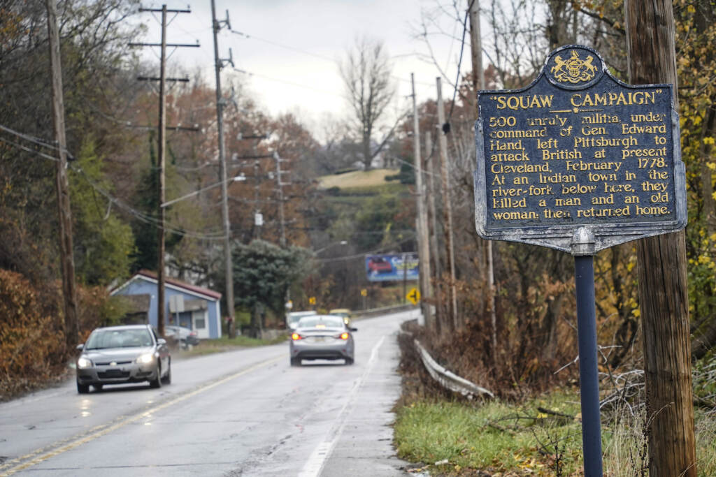 Historical Markers In this photo from Thursday, Nov. 18, 2021, a Pennsylvania Historical and Museum Commission plaque is seen along a roadside in New Castle, Pa. A recent review of all 2,500 markers the Pennsylvania Historical and Museum Commission had been installing for more than a century, faced a fresh round of questions about just whose stories were being told on the state's roadsides, and the language used to tell them. The increased scrutiny that has focused on factual errors, inadequate historical context and racist or otherwise inappropriate references, prompting the state to remove two markers, revise two and order new text for two others so far. The changes have become grist for the political mill. (AP Photo/Keith Srakocic)