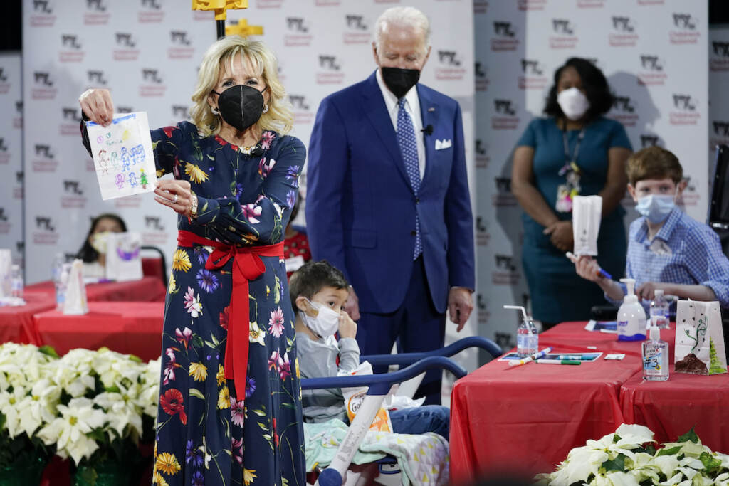 Joe Biden,Jill Biden First Lady Jill Biden displays a lantern made by a patient at Children's National Hospital as part of a winter craft project as she and President Joe Biden visit patients in Washington, Friday, Dec. 24, 2021.