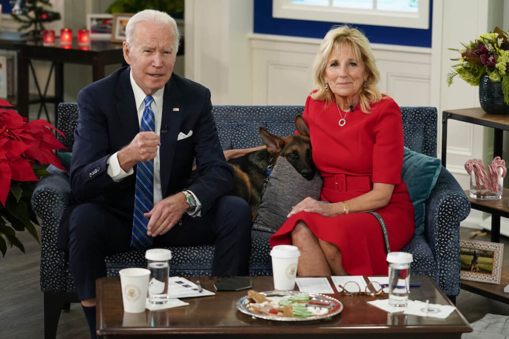 Joe Biden, Jill Biden President Joe Biden, first lady Jill Biden and their new dog Commander, a purebred German shepherd puppy, meet virtually with service members around the world, Saturday, Dec. 25, 2021, in the South Court Auditorium on the White House campus in Washington, to thank them for their service and wish them a Merry Christmas