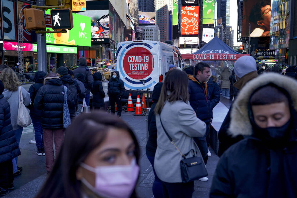 Virus Outbreak FILE - People wait in a long line to get tested for COVID-19 in Times Square, New York, Dec. 20, 2021. U.S. health officials' decision to shorten the recommended COVID-19 isolation and quarantine period from 10 days to five is drawing criticism from some medical experts and could create confusion among many Americans. (AP Photo/Seth Wenig, file)