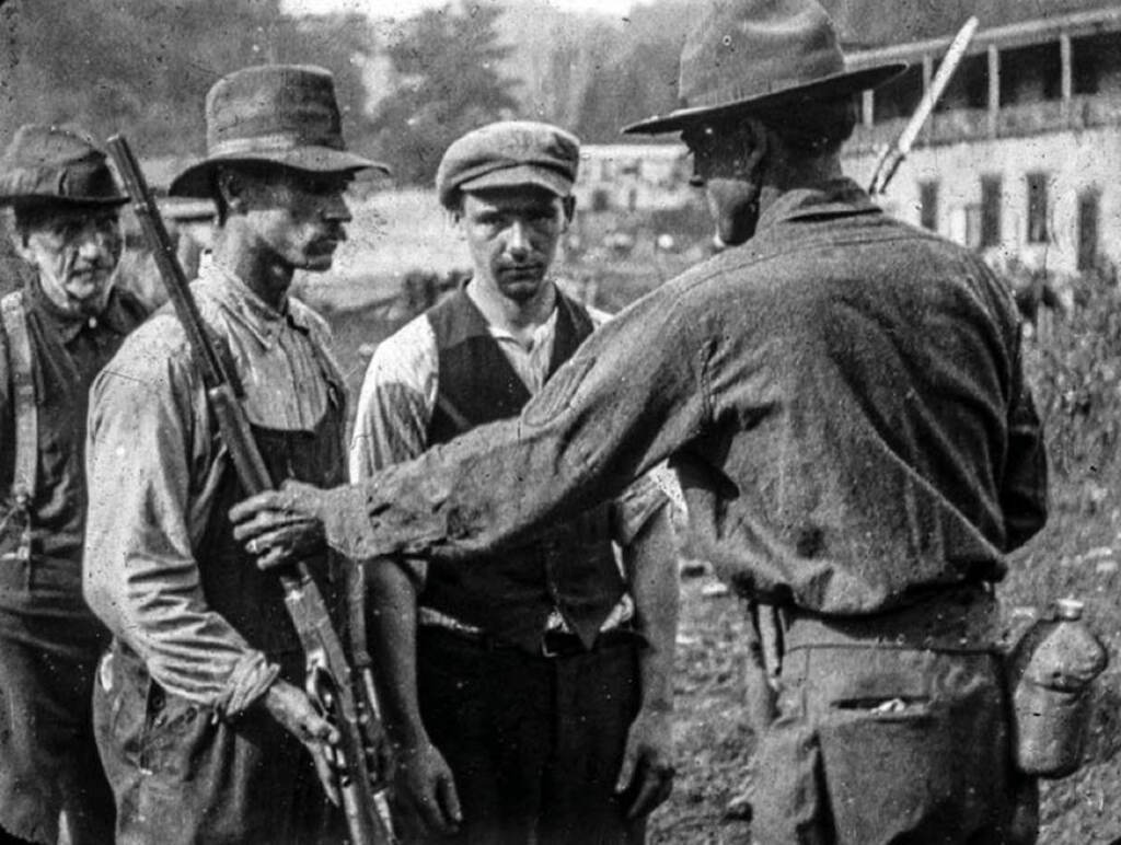 BlairMtn01_1200 After the Battle of Blair Mountain in 1921, union miners surrendered their weapons. (Wikimedia Commons)