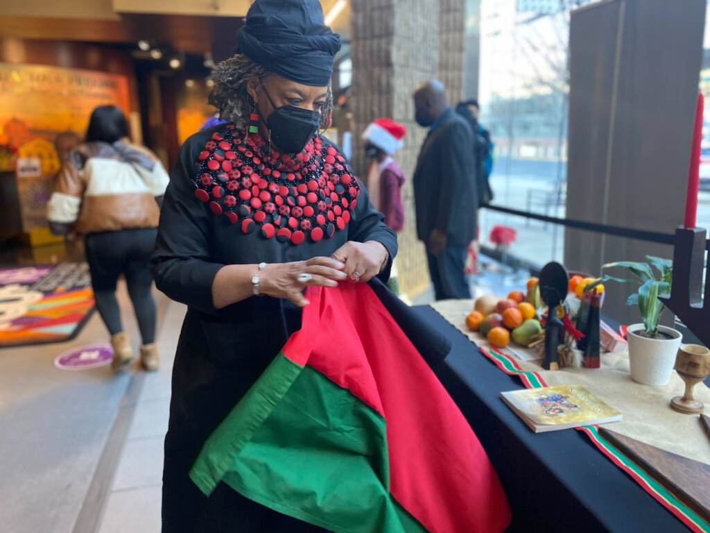 Image from iOS (1) Maisha Ogonza at the first day of the African American Museum in Philadelphia’s Kwanzaa celebration. (Tennyson Donyéa, WHYY)