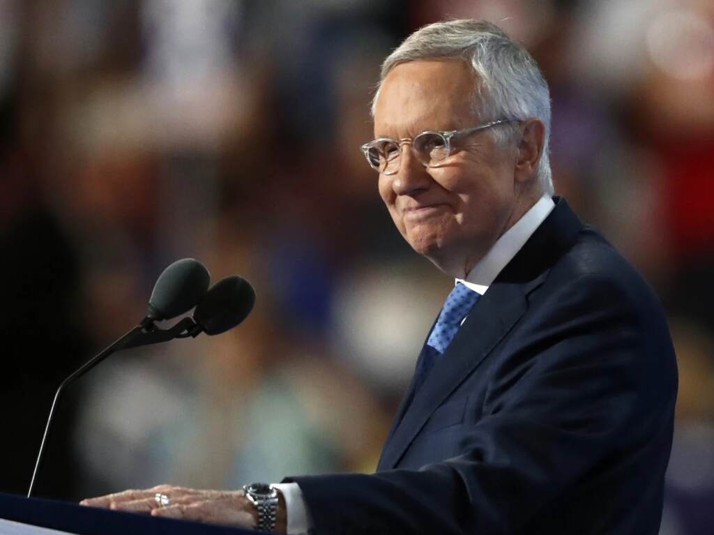 Then-Senate Minority Leader Harry Reid of Nevada smiles as he speaks during the third day of the Democratic National Convention in Philadelphia on July 27, 2016. Senate Minority Leader Harry Reid of Nev., smiles from the podium as he speaks during the third day of the Democratic National Convention in Philadelphia on July 27, 2016. (Paul Sancya/AP)