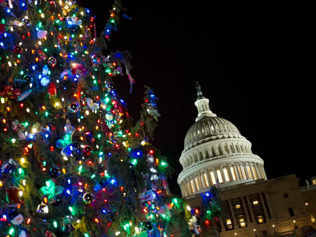 President Biden on Friday signed legislation to avoid a partial government shutdown, but Congress still has a long to-do list before the end of the year. U.S. Capitol is seeing behind the Christmas Tree in Washington, Wednesday, Dec. 14, 2016