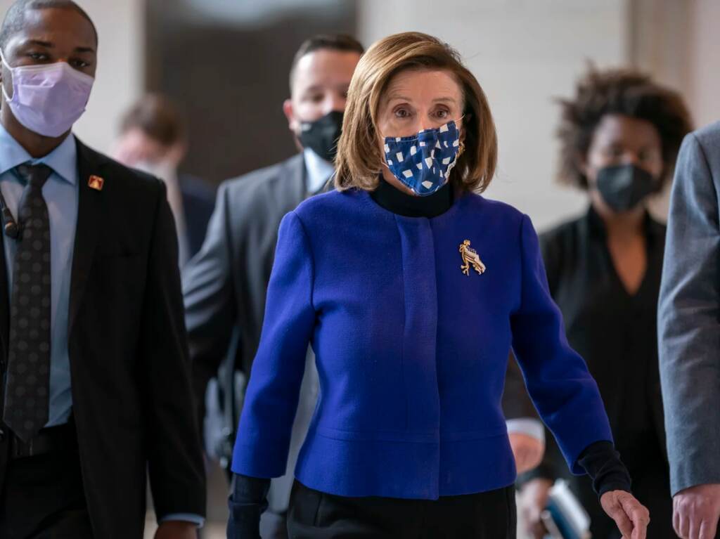 House Speaker Nancy Pelosi, D-Calif., arrives at the Capitol Thursday to update reporters on the must-pass priority of funding the government. Speaker of the House Nancy Pelosi, D-Calif., arrives to update reporters on the must-pass priority of funding the government, during a news conference at the Capitol in Washington, Thursday, Dec. 2, 2021.