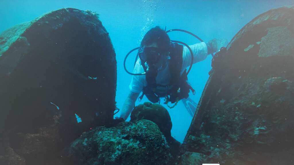 best A member of Project Recovery combs through the debris of a downed aircraft found in the Pacific Ocean off Palau. (Project Recover)