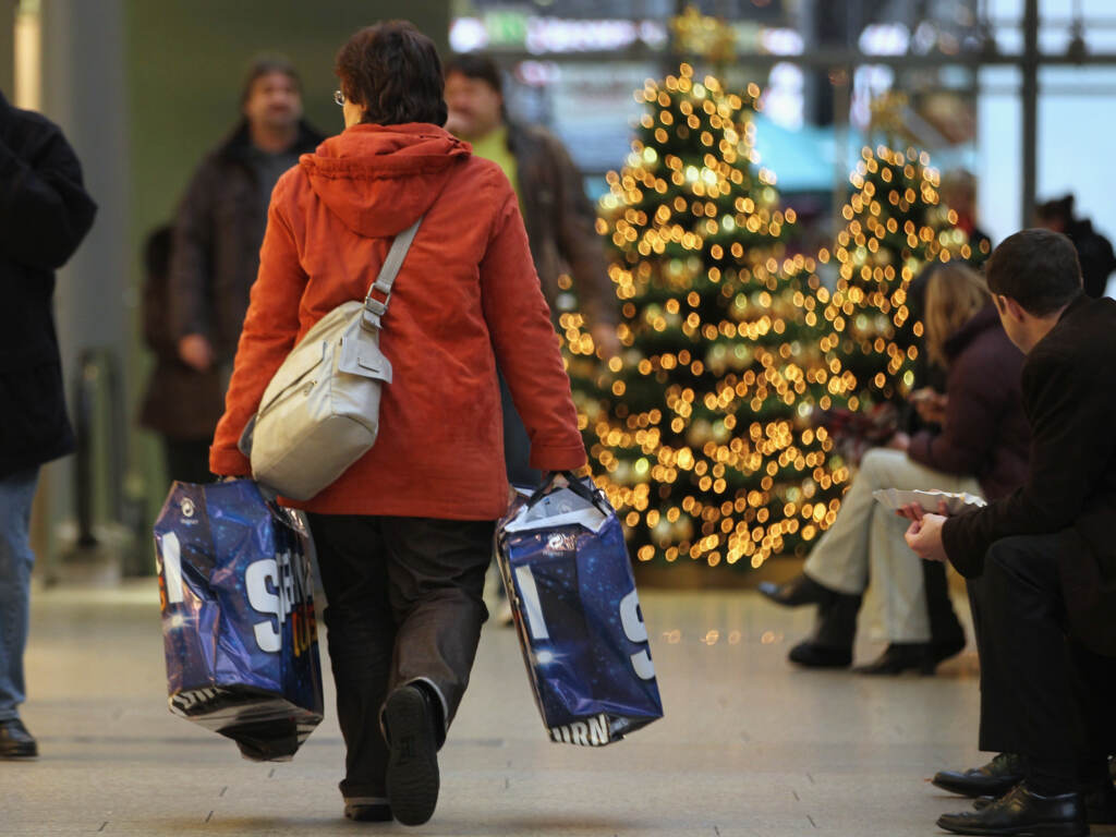 A woman carries shopping bags through a shopping mall on November 22, 2010 in Berlin, Germany. German retailers are hoping for a strong Christmas season on the heels of a robust German economic turnaround following the financial crisis of 2009.  (Photo by Sean Gallup/Getty Images)
