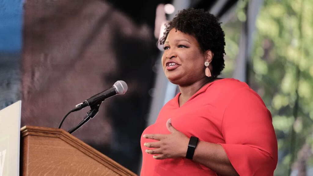 Democrat Stacey Abrams has risen to national prominence following her narrow loss in Georgia’s 2018 governor’s race. Voting rights activist Stacey Abrams speaks during a get-out-the-vote rally for Democratic gubernatorial candidate, former Virginia Gov. Terry McAuliffe at Ting Pavilion on October 24, 2021 in Charlottesville, Virginia. The Virginia gubernatorial election, pitting McAuliffe against Republican candidate Glenn Youngkin, is November 2.