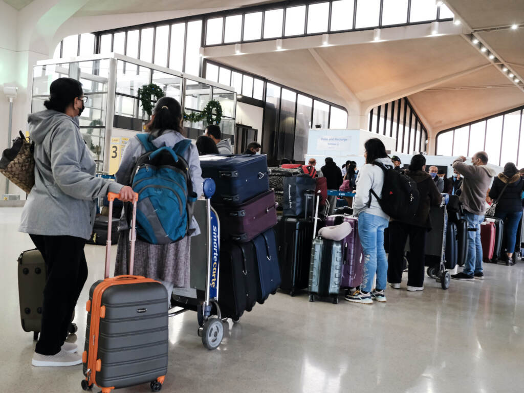 U.S. Imposes Travel Restrictions On Southern African Countries Due To COVID Variant Travelers arrive for flights at Newark Liberty International Airport