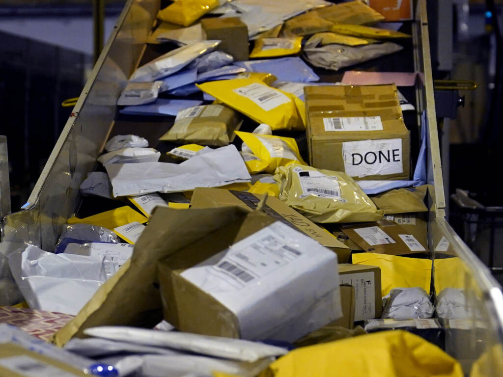 Holiday Shipping Parcels jam a conveyor belt at the United States Postal Service sorting and processing facility