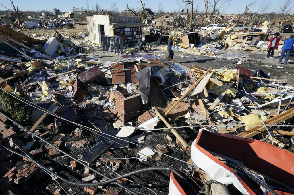 Midwest Tornadoes People retrieve items from a destroyed law office