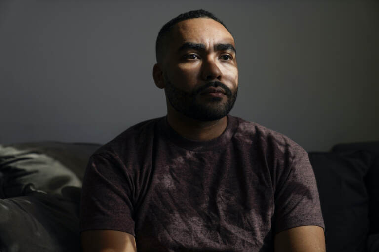 Kyle Bibby poses for a picture at his home in Jersey City