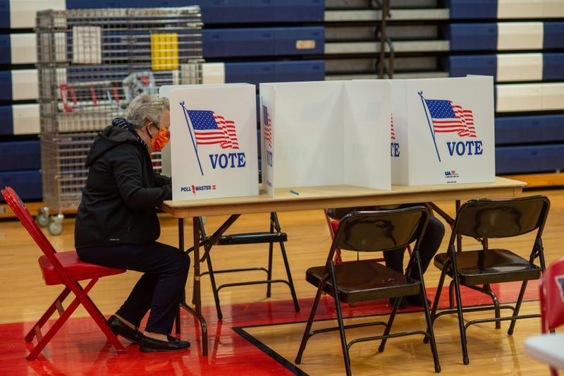 vote-election-spa-121621 A person casts their vote in a rec center