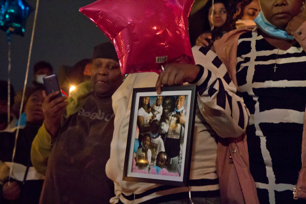 2022 1 6 k paynter fairmount fire victims vigil-4 Family members of those that died in the Fairmount row home fire held pictures of their lost loved-ones at a candlelight vigil at 22nd and Brown Streets in Philadelphia on Jan. 6, 2022. (Kimberly Paynter/WHYY)