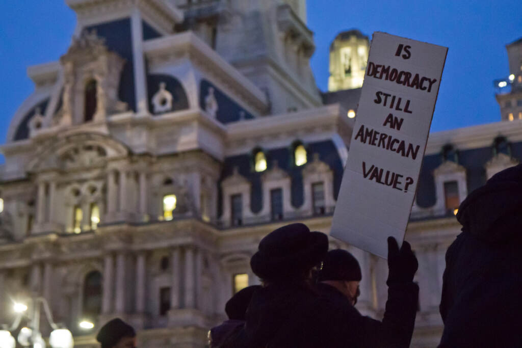 2022 1 6 k paynter insurrection vigil-4 About 40 people gathered in Philadelphia’s Thomas Paine Plaza at a candlelight vigil remembering the attacks on the U.S. Capital a year later, on January 6, 2022. (Kimberly Paynter/WHYY)