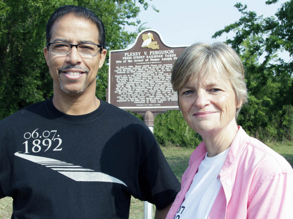 Plessy-Pardon FILE - Keith Plessy and Phoebe Ferguson, descendants of the principals in the Plessy V. Ferguson court case, pose for a photograph in front of a historical marker in New Orleans, on Tuesday, June 7, 2011. Homer Plessy, the namesake of the U.S. Supreme Court’s 1896 “separate but equal” ruling, is being considered for a posthumous pardon. The Creole man of color died with a conviction still on his record for refusing to leave a whites-only train car in New Orleans in 1892. (AP Photo/Bill Haber, File)