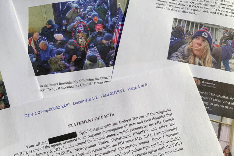 FILE - This statement of facts from the FBI in support of bringing charges against Jennifer Leigh Ryan of Frisco, Texas, is photographed on Nov. 4, 2021. The Texas real estate agent who bragged she wasn't going to jail for storming the U.S. Capitol because she is white, has blond hair and good job has been sentenced to two months behind bars. (AP Photo/Jon Elswick, File)