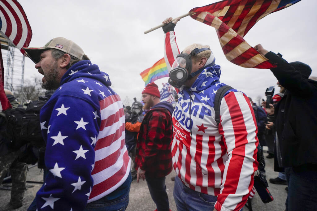 Capitol Riot America At War With Itself Pro-Trump insurrectionists yell on the West Front of the U.S. Capitol