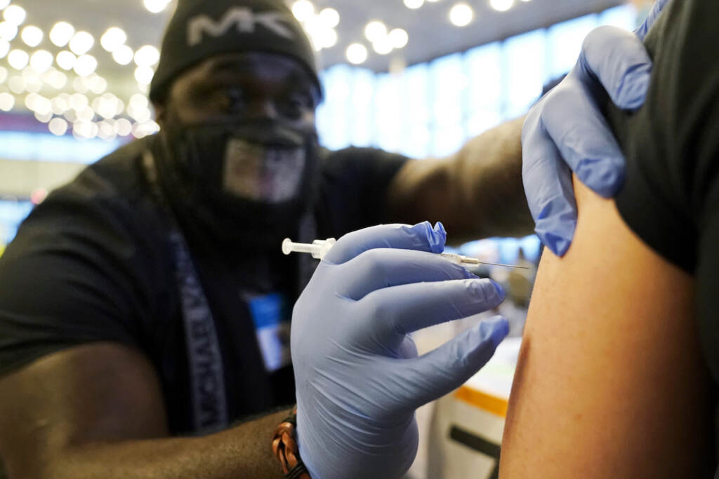 Virus Outbreak Close-up of a nurse about to vaccinate someone.