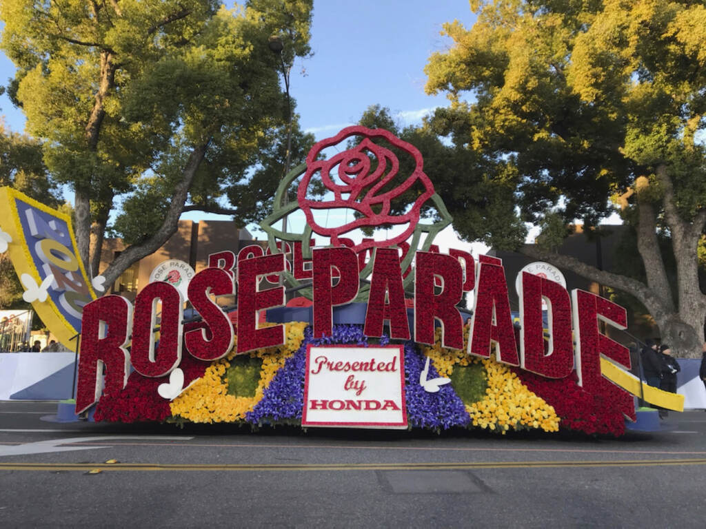 FILE - In this Jan. 1, 2020, file photo, a 2020 Rose Parade float is seen at the start of the route at the 131st Rose Parade in Pasadena, Calif. The Rose Parade and Rose Bowl college football game between Ohio State and Utah were set to go forward on New Year's Day despite surging cases of COVID-19, which forced the cancelation of the 2021 parade. (AP Photo/Michael Owen Baker, File)