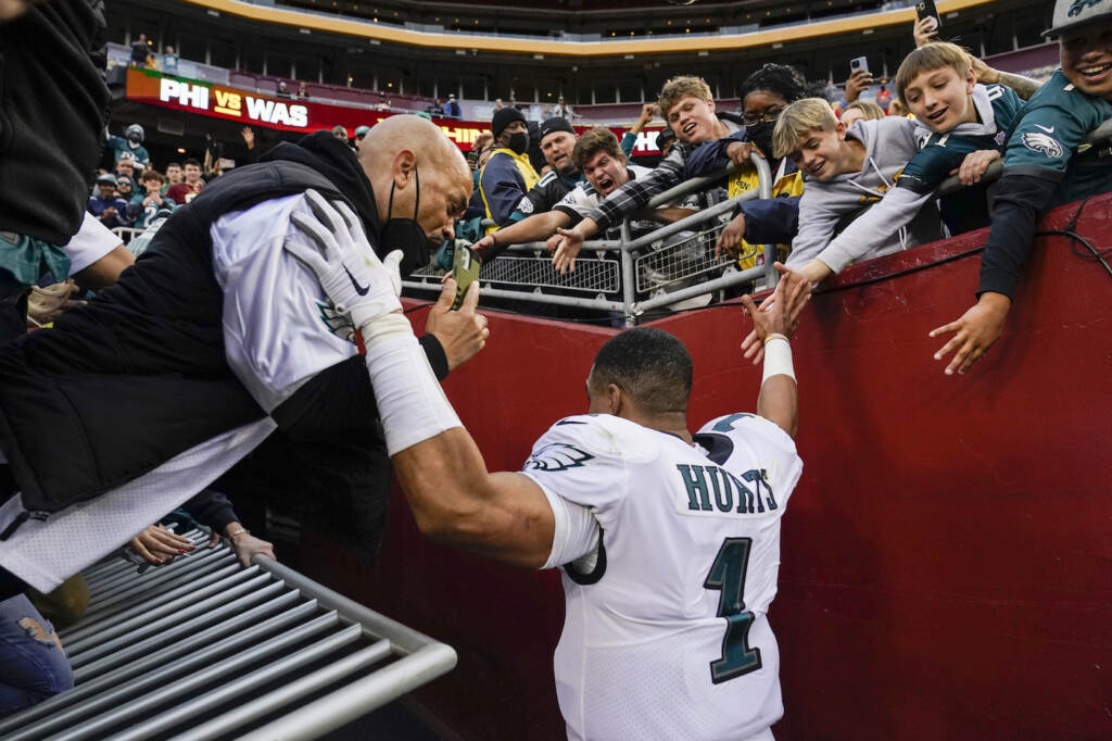 Jalen Hurt A hand railing collapses and fans fall onto Philadelphia Eagles quarterback Jalen Hurts (1) following the end of an NFL football game, Sunday, Jan. 2, 2022, in Landover, Md. Philadelphia won 20-16. (AP Photo/Alex Brandon)