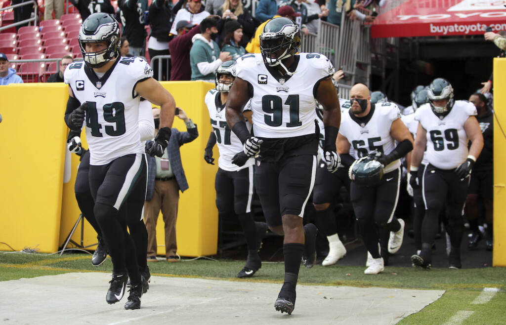 Eagles Washington Football Philadelphia Eagles defensive tackle Fletcher Cox (91) leads out his team before a game against the Washington Football Team, Sunday, Jan. 02, 2022 in Landover. (AP Photo/Daniel Kucin Jr.)