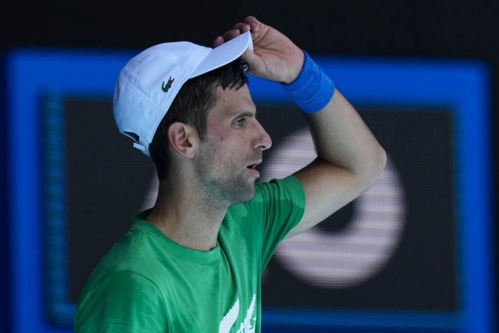 Australian Open Djokovic Defending men’s champion Novak Djokovic practices on Margaret Court Arena ahead of the Australian Open tennis championship in Melbourne, Australia, Thursday, Jan. 13, 2022. AP Photo/Mark Baker)