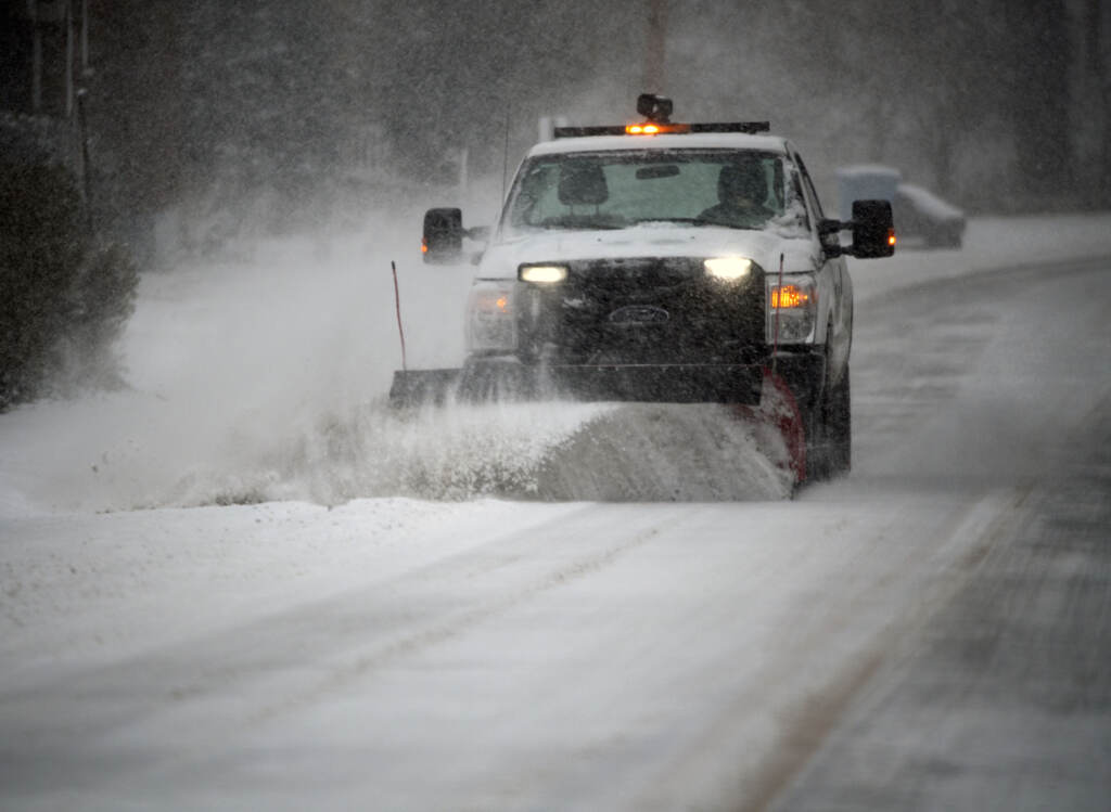 Winter Storm A snowplow clears a main road during a winter storm in Southwest Roanoke City on Sunday, Jan. 16, 2022, in Roanoke, Va. (AP Photo/Don Petersen)