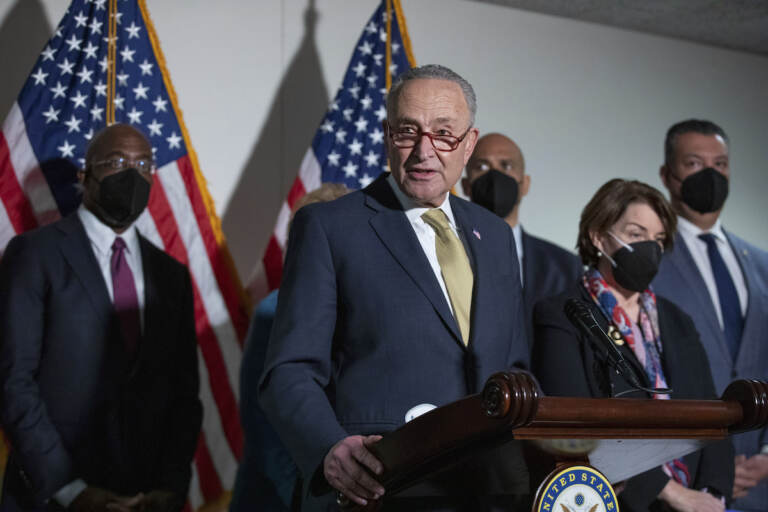 Senate Majority Leader Chuck Schumer, D-N.Y., speaks to reporters alongside, from left, Sen. Raphael Warnock, D-Ga., Sen. Cory Booker, D-N.J., Sen. Amy Klobuchar, D-Minn., and Sen. Alex Padilla, D-Calif., during a press conference regarding the Democratic party's shift to focus on voting rights at the Capitol in Washington, Tuesday, Jan. 18, 2022