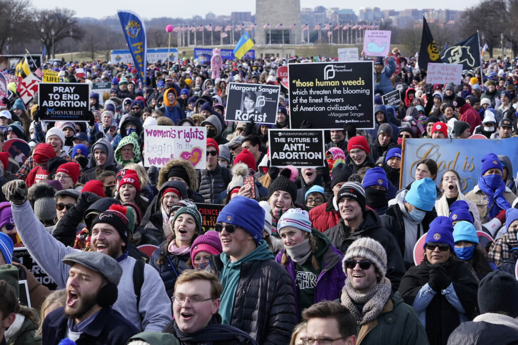 People attend the March for Life rally on the National Mall in Washington, Friday, Jan. 21, 2022. The March for Life, for decades an annual protest against abortion, arrives this year as the Supreme Court has indicated it will allow states to impose tighter restrictions on abortion with a ruling in the coming months. (AP Photo/Susan Walsh)