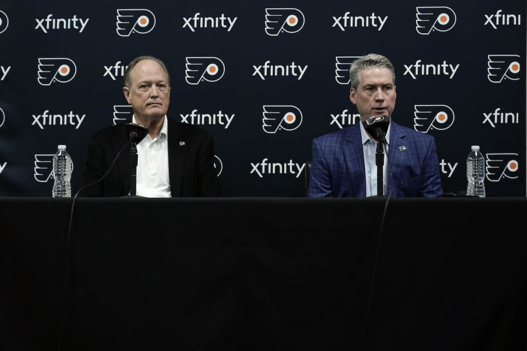 Flyers Unlucky 13 Hockey Philadelphia Flyers chairman Dave Scott, left, and Flyers general manager Chuck Fletcher take part in a news conference at the team's NHL hockey practice facility, Wednesday, Jan. 26, 2022, in Voorhees, N.J. The Flyers have lost a team-record 13 straight games