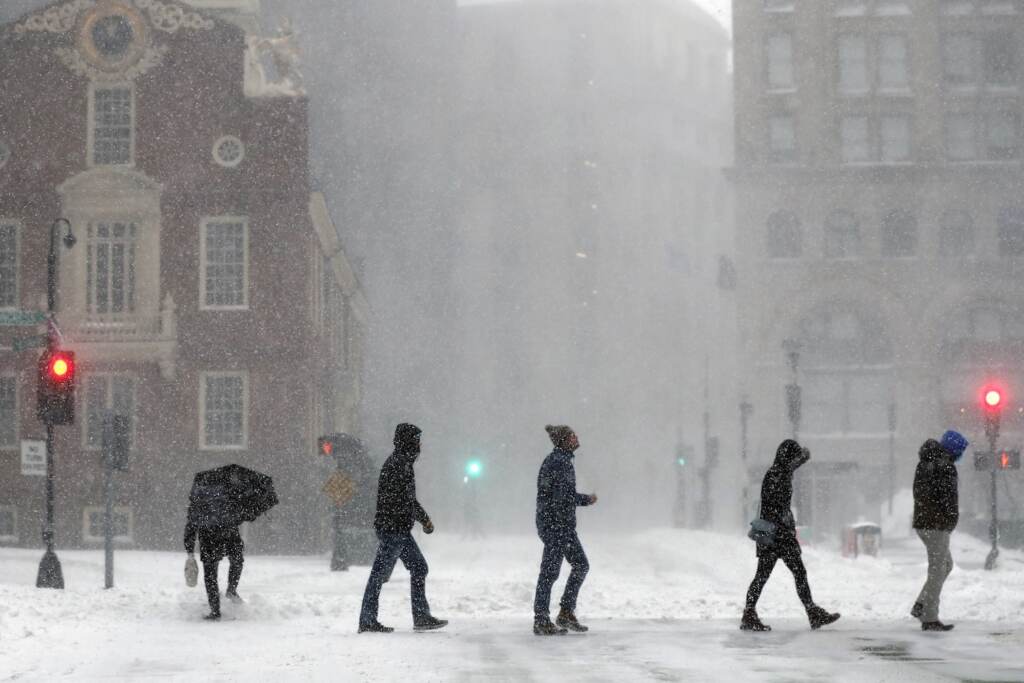 Winter Weather Massachusetts People cross Congress Street, Saturday, Jan. 29, 2022, in Boston. Forecasters watched closely for new snowfall records, especially in Boston, where the heaviest snow was expected late Saturday. (AP Photo/Michael Dwyer)