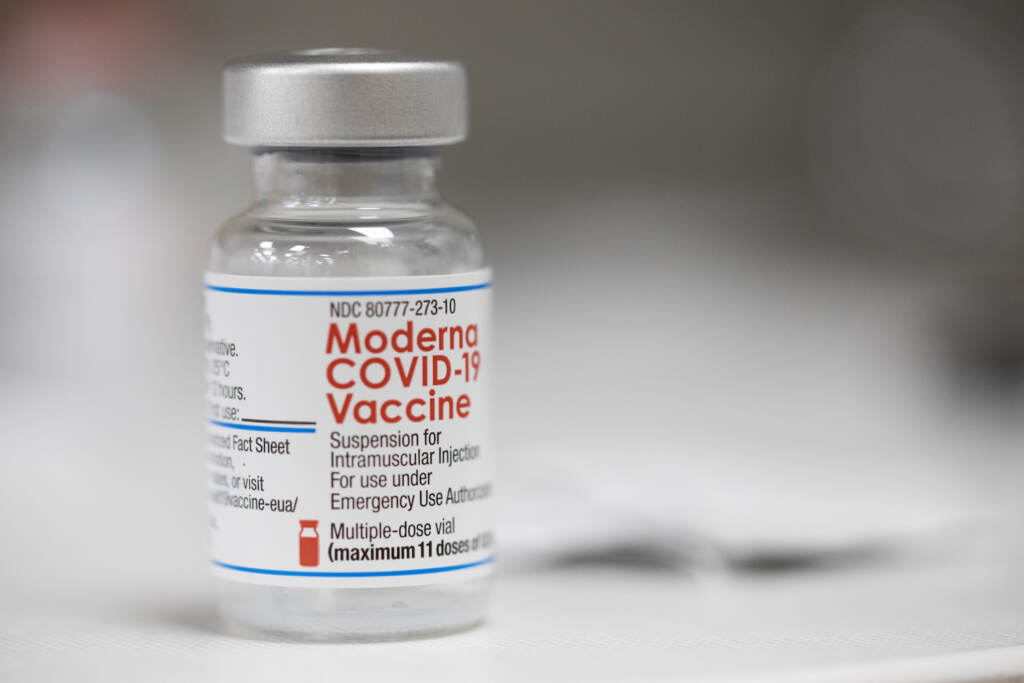 Moderna Vaccine A vial of the Moderna COVID-19 vaccine is displayed on a counter at a pharmacy in Portland, Ore., Monday, Dec. 27, 2021. U.S. regulators have granted full approval to Moderna’s COVID-19 vaccine after reviewing additional data on its safety and effectiveness. The decision Monday, Jan. 31, 2022 by the Food and Drug Administration comes after many tens of millions of Americans have already received the shot under its original emergency authorization. Full approval means FDA has completed the same rigorous, time-consuming review for Moderna’s shot as dozens of other long-established vaccines. (AP Photo/Jenny Kane)